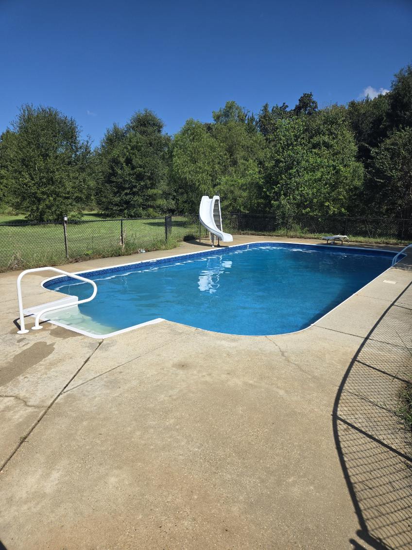 Clean concrete around the swimming pool after washing