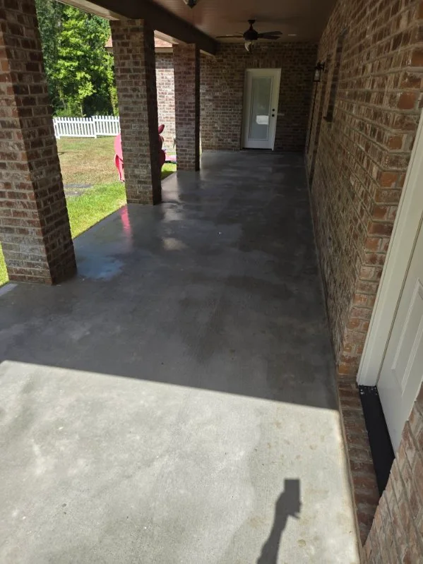 Surface-cleaner equipment mid-job on a concrete patio