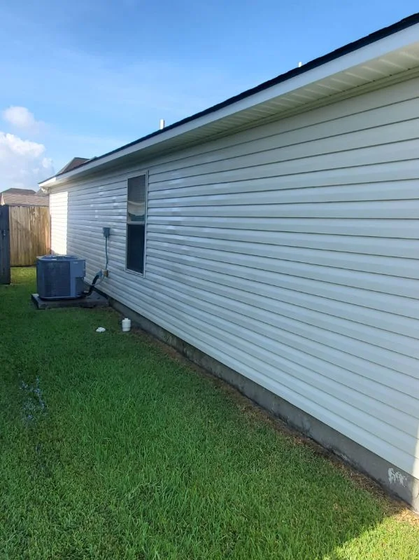 The same exterior siding after a wash